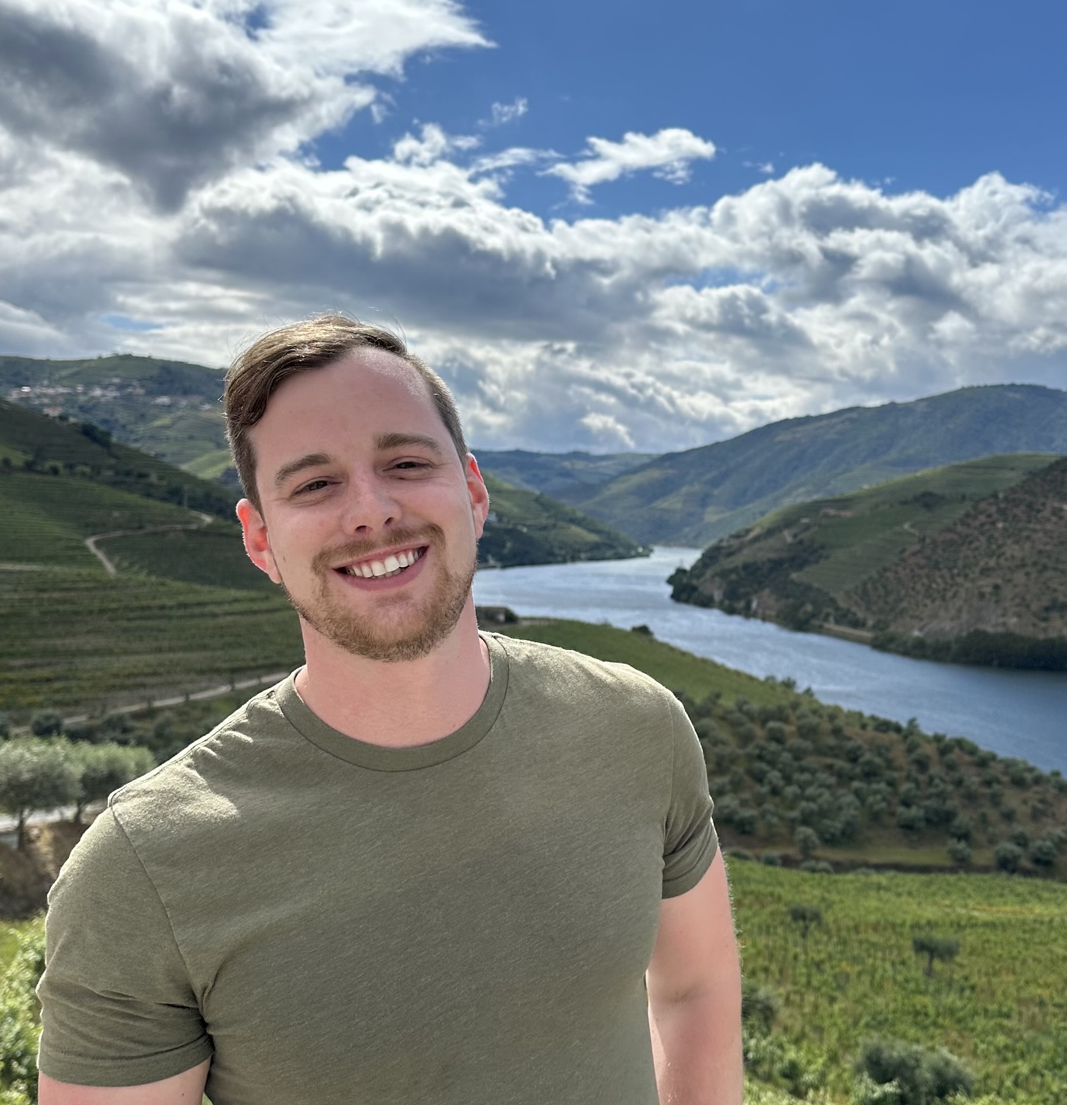 Paul in front of a scenic river valley